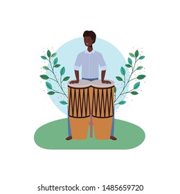 man with congas and branches and leaves in the background