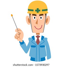 A man at the construction site in blue work clothes guides with a pointing stick