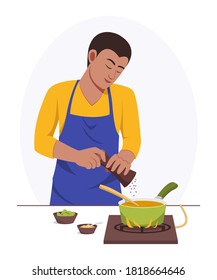 El hombre cocina en casa solo.
