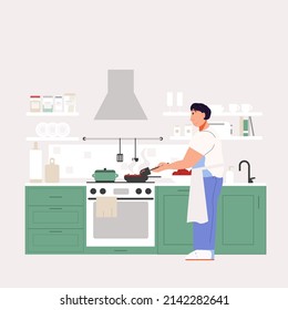The man is cooking in the kitchen. Apron for cooking. Cozy kitchen with appliances and utensils.