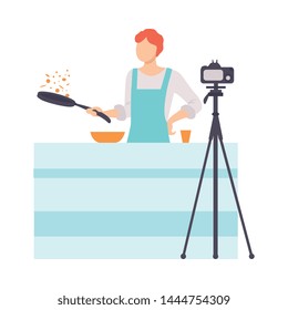 Man Cooking at Kitchen and Recording Video on Camera, Male Food Blogger Creating Content about His Hobby and Posting It on Social Media Vector Illustration