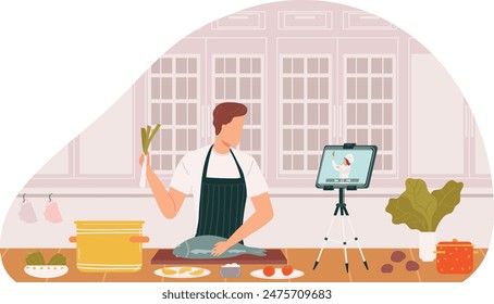 Man cooking while watching recipe video tablet kitchen setup. Male home cook prepares fish learns culinary skills digital tutorial. Casual attire apron using technology kitchen counter ingredients