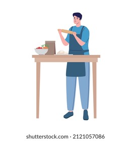 man cooking in wooden table
