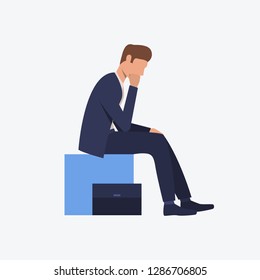 Man in costume sitting on blue cube. Manager, office, meeting. Can be used for topics like  business, working, communication