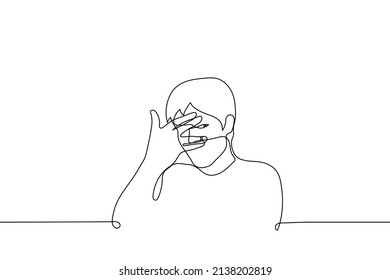 man covers face with palm but spreads fingers and peeps - one line drawing vector. concept of guilty pleasure, unwillingness to look, close one's own eyes