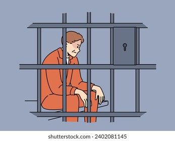 Man criminal sits in prison cell and is sad because of unfair court decision or lack of right to amnesty. Prisoner is serving prison sentence in correctional facility after committing illegal acts.