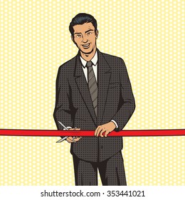 Man cuts red ribbon pop art style vector illustration. Comic book style imitation. Successful businessman with red ribbon