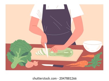 A man cuts vegetable preparing a meal