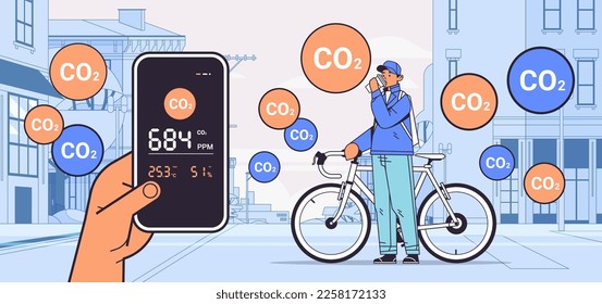 man cycling outdoor with with air quality monitor test on the presence of dangerous CO2 control level testing