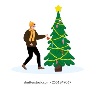 Man decorates a Christmas tree with ornaments in a winter setting