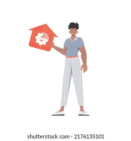 The man is depicted in full growth, holding the icon of the house in his hands. IOT and automation concept. Vector illustration in trendy flat style.