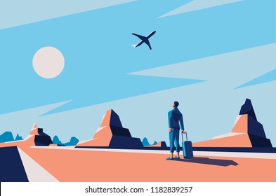 Man in desert looking at a plane