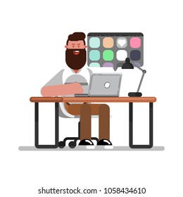 Man designer searching for references on laptop