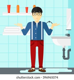 Man in despair standing near leaking sink.