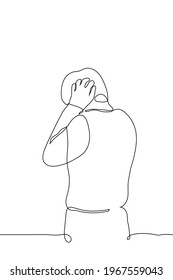 man desperately covering his ears - one line drawing vector. guy stands with his back to the viewer (face is not visible), his palms tightly cover ears. concept of unwillingness to hear loud noise