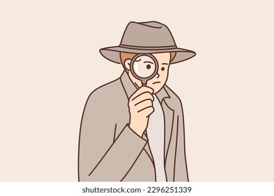 Man detective use magnifying glass to investigate crime scene or looking for necessary information. Guy detective in hat and long coat similar to sherlock holmes looks through loupe at screen