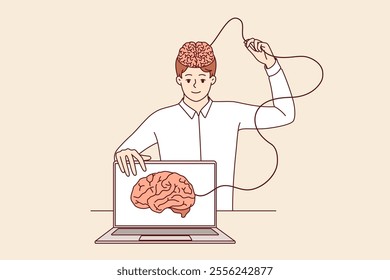 Man develops artificial intelligence and transfers own brain to internet, standing near laptop. Process of learning ai technologies to create innovative software with artificial intelligence