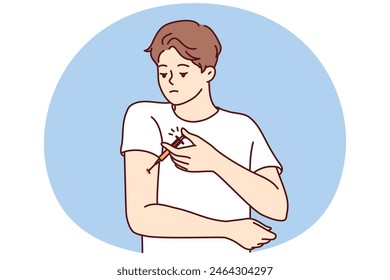 Man with diabetes makes injection in arm to lower blood sugar and avoid insulin shock. Guy is experiencing problems and need for regular injections after suffering from diabetes or infectious flu
