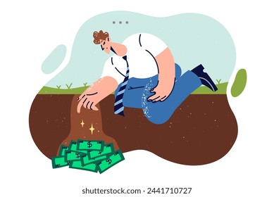 Man digs money out of ground after finding valuable cache of cash during random walk. Guy is burying money due to lack of trust in banks and investments or other financial institutions