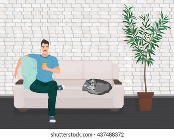 Man with dog pet lying relaxing on the sofa couch and drinking coffee. 