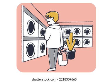 A man doing laundry at a laundromat