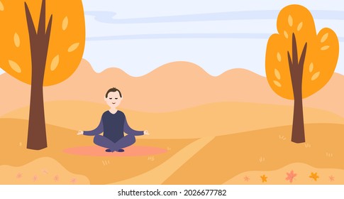 A man doing yoga in an autumn park.