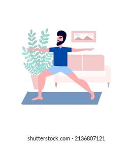 Man doing yoga exercise at home. Man with beard doing yoga pose in home interior