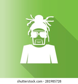 man with dreadlocks wearing reggae hat with long shadow.