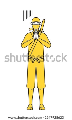 A man dressed up as a ninja apologizing with his hands in front of his body.