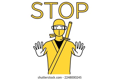 A man dressed up as a ninja with his hand out in front of his body, signaling a stop.
