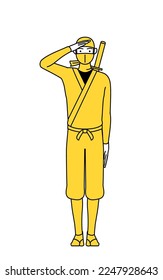 A man dressed up as a ninja making a salute.