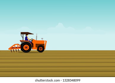 The man is driving a orange tractor. In order to plow the soil in the field. Have a blue sky background