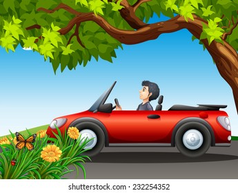 A man driving a red car at the street