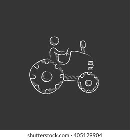 Man driving tractor. Drawn in chalk icon.