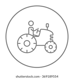 Man driving tractor line icon.