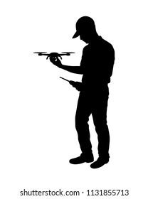 The man with drone and remote control in hand silhouette vector