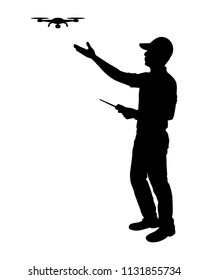 The man with drone and remote control in hand silhouette vector