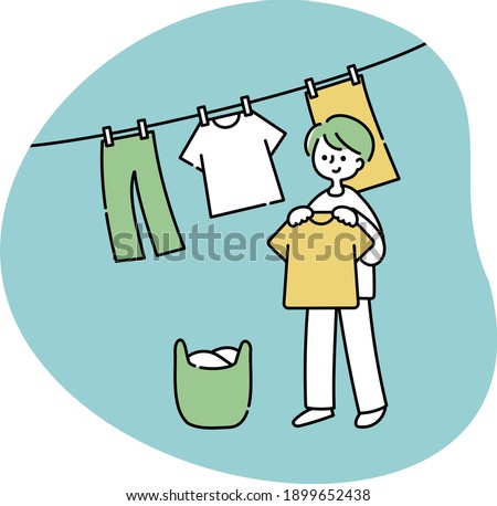 A man drying his washed clothes