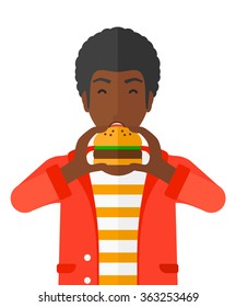 Man eating hamburger. 