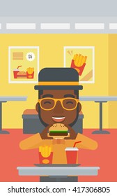 Man eating hamburger. 