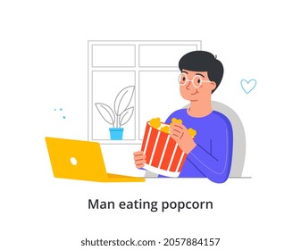 Man Eats Popcorn Concept. Guy Sitting At His Laptop, Watching Movie Or Series And Eating Delicious Corn Snack. Evening Rest At Home. Cartoon Flat Vector Illustration Isolated On White Background