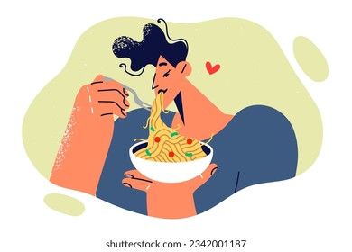 Man eats spaghetti or pasta ordered from italian restaurant and enjoys long-awaited dinner. Young guy eats appetizing dish with vegetables and delicious sauce to remove appetite.