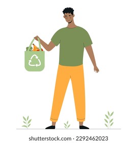 Hombre con bolsa ecológica. El cuidado de la naturaleza y el medio ambiente, cero residuos, estilo de vida sostenible. Reciclaje y reutilización. Activista y voluntaria amigable con el ambiente.