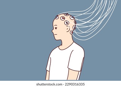 Man with electrodes connected to head to study brain activity and work of neurons or mind control. Wires connected to head of bald guy to develop neurotechnologies or create biorobots