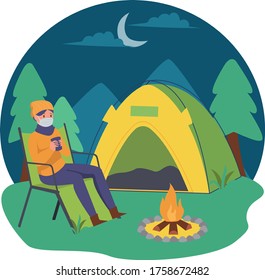 A man enjoying hot drink while camping alone