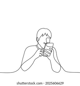 man enthusiastically looks at the phone close to his eyes - one line drawing. the concept of guilty pleasure, internet addiction, obsession with social networks, obsession with internet scandals 