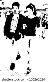 The man is escorting his friend while she's holding her mobile phone while crossing their arms together.