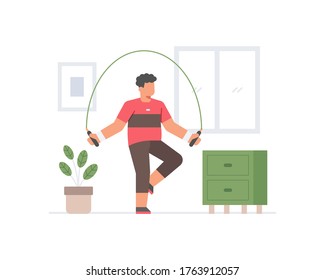A man exercising in the house doing skipping rope