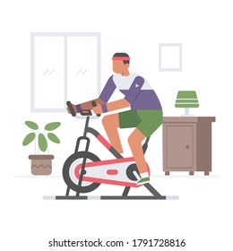 Un hombre hace ejercicio usando una bicicleta cubierta en la casa