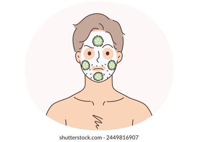 Man with facial mask for smooth healthy skin. Unhappy male do face procedures put cucumbers for hydration. Beauty and skincare. Vector illustration.